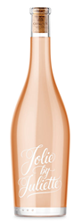 Jolie by Juliette rosé wine in a tall pale pink bottle with white script label and cork stopper.