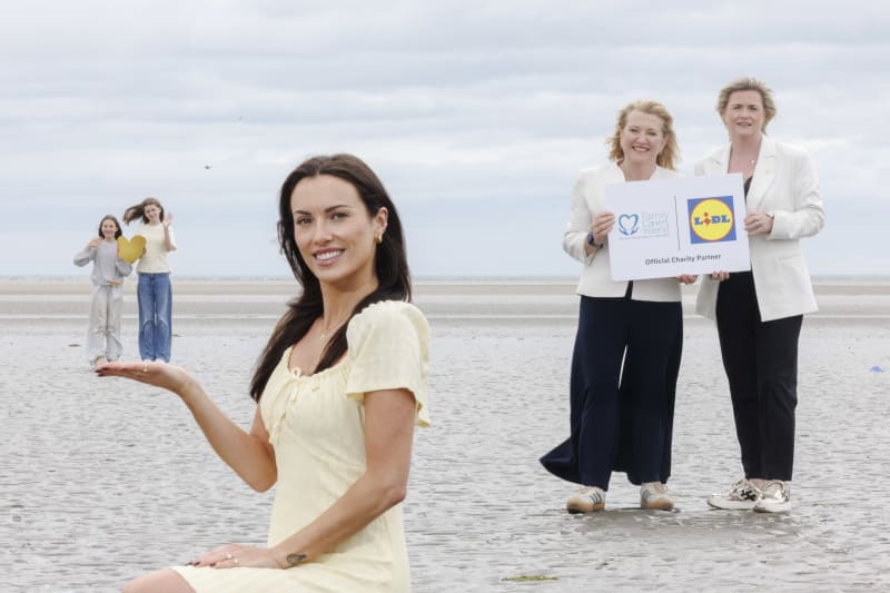 Women on a beach at the Lidl and Family Carers Ireland Official Charity Partnership launch event.