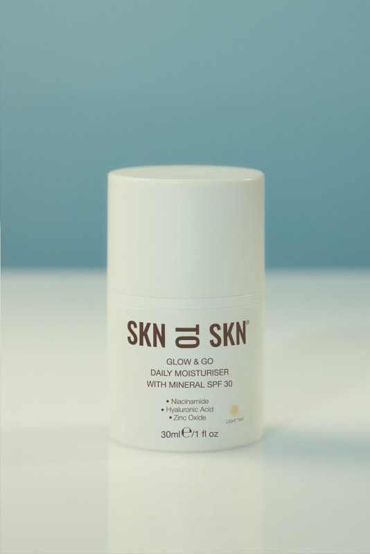 SKN to SKN Glow & Go Daily Moisturiser with Mineral SPF 30 in Light Tint, 30ml white pump bottle.