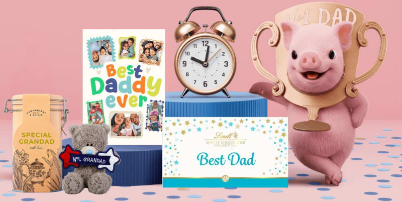 Father's Day gift selection including Lindt Best Dad chocolates, Cartwright & Butler Grandad tin, Me to You bear, alarm clock and trophy mug.