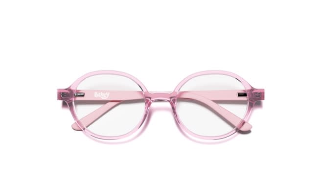 Round transparent pink acetate eyeglasses with clear lenses, folded, on white background.