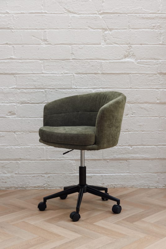 Green velvet bucket office chair with channel stitching, black five-star castor base, chrome height adjustment.