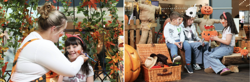 Children enjoying a Halloween event with face painting and festive autumn decorations including pumpkins and a scarecrow.